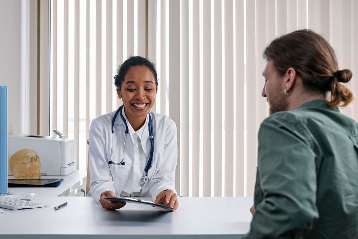 A doctor talking with a patient during a consultation